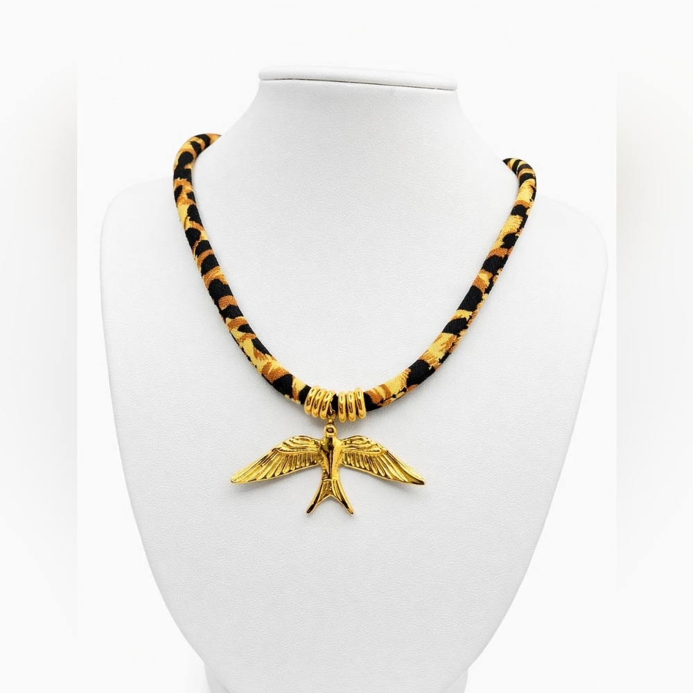 Gold Bird Pendant Necklace with Black and Yellow Patterned Cord